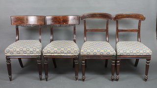 A pair of Georgian mahogany bar back dining chairs raised on turned and reeded supports and a pair of similar bar back chairs