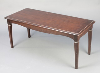 A Stag mahogany Minstrel coffee table raised on square tapered supports 17.5"h x 41"w x 17.5"d