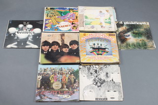 A collection of LP records including The Beatles Revolver, Please Please Me, Yellow Submarine, etc 