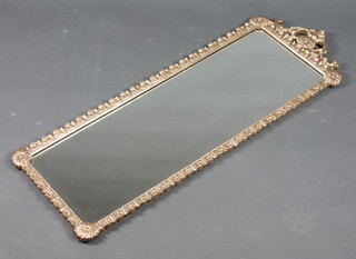 A rectangular plate wall mirror contained in a decorative gilt frame 41"h x 14"w