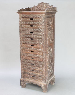 A Chinese carved hardwood pedestal tray chest with three-quarter gallery fitted 10 square twin handled trays 54" x 19 1/2" x 16", deeply and heavily carved throughout 