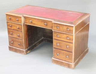 A Victorian mahogany breakfront desk/dressing table with red inset writing surface above 1 long and 8 short drawers with tore handles 25"h x 53"w x 25 1/2"d  (This piece is designed to stand against a wall) 