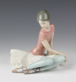 A Lladro figure of a seated ballerina, impressed 1357 6 1/2"h