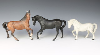 Two Beswick horses  "Black Beauty" HN2466 7 1/4"h and a stocky jogging mare, rocking horse grey, gloss finish, No 1090 6"h, a Royal Doulton figure of a racehorse, matt finish 8"h