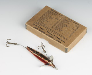 A Hardy 1920's cardboard box containing a vintage swallow tail lure 

