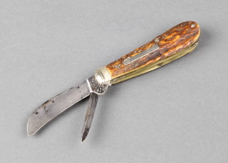 An early 19th Century twin bladed pen knife, stamped J & J Oates, Cornhill, with stag horn grip, narrow square kick, hawkbill blade and a traditional quill with white metal mounts