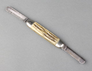 A rare 20th Century dog stripping jack knife the 3 1/2" blade marked MK, with jigged bone grip and white metal mounts
