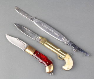 An Indian lock back novelty pocket knife with ratchet mechanism, a Beretta advertising knife with cartridge extractor and a brass and bone novelty pen knife, in the form of a pistol,  the blade marked Valley Forge and stamped Parker Cutlery