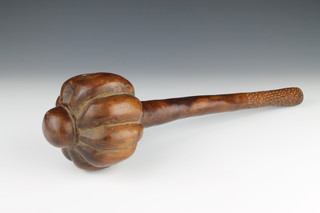 A 19th Century Fijian hardwood throwing club with serrated head, the grip with geometric carving 17" 