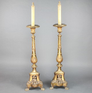 An impressive pair of 19th Century gilt bronze Rococo style standard lamps, the body's applied swags, on claw feet 43" h x 8" diam