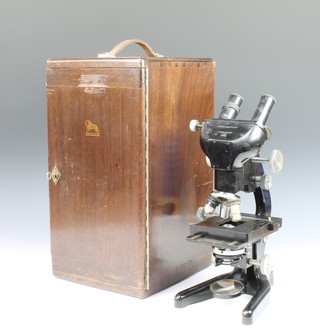 W Watson & Sons, a bacterial binocular microscope no.106056 together with a magnification table certificate dated 14-3-51 and a box containing various slides and lenses
