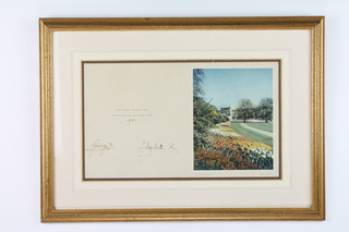 Of Royal Interest, a Christmas card signed George R and Elizabeth R, dated 1951, with a photograph of the gardens and Buckingham Palace,Spring 1950