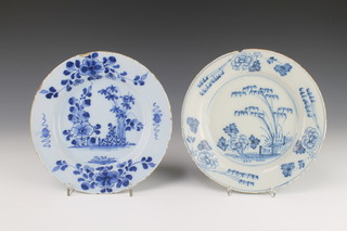 An 18th Century English Delft blue and white plate with garden view enclosed by flowers 9", a do. 9"