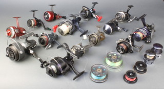 A box of various mixed vintage spinning reels including 2 Face Abu reels