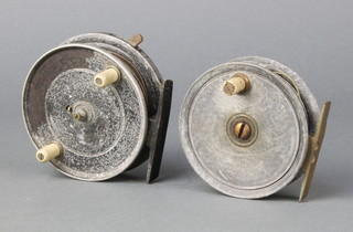 A vintage centre pin fly reel 3 1/2" together with a trotting reel 3 1/2"