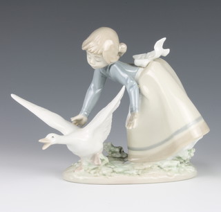 A Lladro figure of a girl with goose 5553 6" 