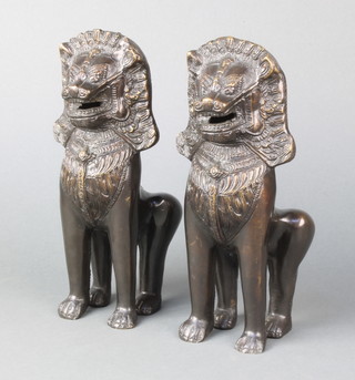 A pair of bronze figures of seated lions 9"h x 3"w x3"d
