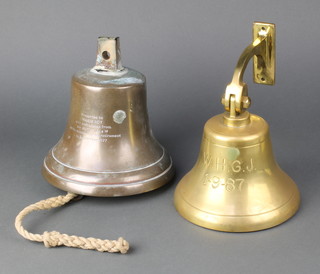 A brass ships bell, inscribed 8"h x 8"d together with one other marked W.H.G.J1.9.87 with brass wall mounting 5"h x 7"d