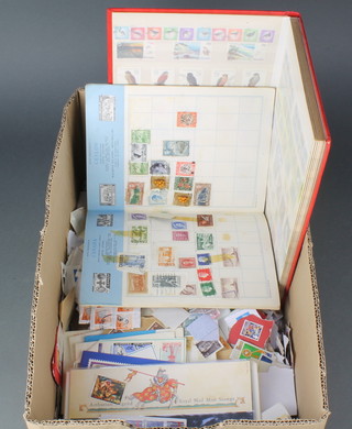 An album of various used world stamps,a stockbook of various mint & used world stamps and a  collection of loose stamps 