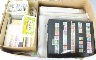 A box containing various loose unmounted world stamp