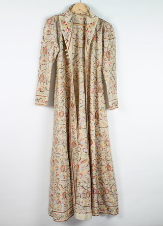 A 19th/20th Century full length lady's coat, heavily embroidered throughout