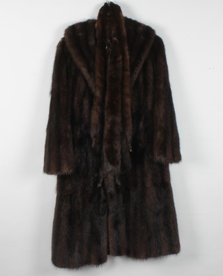 A lady's musquash coat retailed by Marshall and Snellgrove together with a mink stole