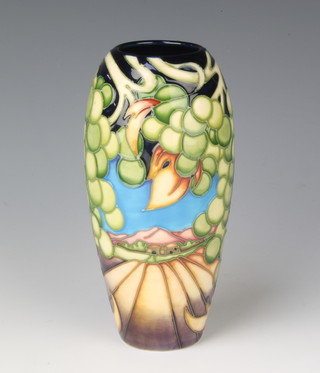 A modern Moorcroft oviform vase decorated with grapes 7 1/2"