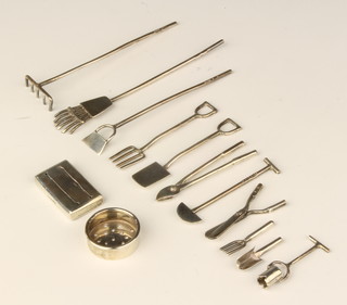 A collection of miniature silver garden tools including spade, fork, cutters, rake, hoe, etc, mixed dates, all by the maker EVS approx. 48 grams