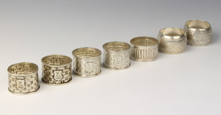 A set of 4 Victorian silver basket weave napkin rings, Sheffield 1886, 3 other napkin rings, 157 grams