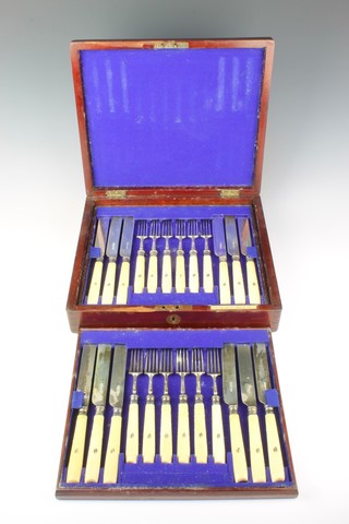 A cased set of 18 Victorian silver and ivory dessert eaters, Sheffield 1893 by Harrison Bros & Howson, contained in a mahogany canteen