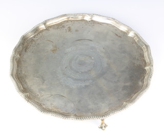 A Victorian silver salver with chased swags and vacant cartouche on claw and ball feet, London 1878, Thomas Bradbury & Sons, 26ozs