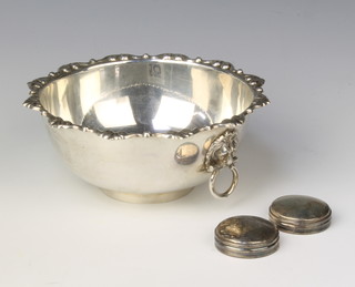 An Edwardian silver bowl with lion ring handles, Birmingham 1910 together with 2 silver jar lids, 200 grams