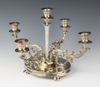 A Victorian 5 light table candelabrum with scroll arms raised on bun feet, 10"h 