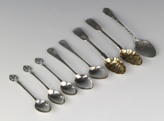 A Victorian silver berry tea spoon, London 1860 and other spoons, 120 grams