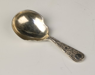 A Victorian silver caddy spoon with fancy handle, Exeter 1860