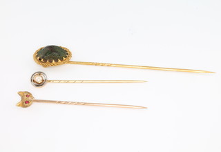 A gentlemans Edwardian gold fox head stick pin, 2 others