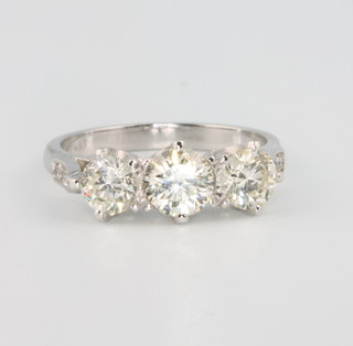 An 18ct white gold 3 stone diamond ring, approx 1.75ct, size N