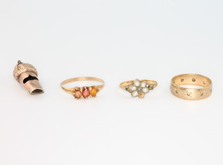 Three 9ct yellow gold gem set rings, sizes K, O & U together with a whistle