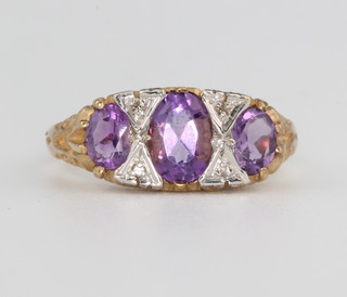 A 9ct yellow gold amethyst and gem set ring size P