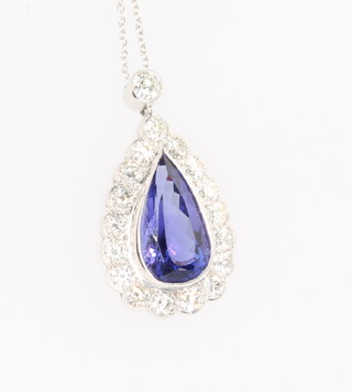 A white gold pear shaped tanzanite and diamond pendant, the tanzanite approx 5.4ct surrounded by brilliant cut diamonds approx 1.9ct