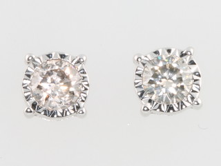 A pair of 18ct white gold single stone diamond earstuds with screw backs, each approx 0.44ct