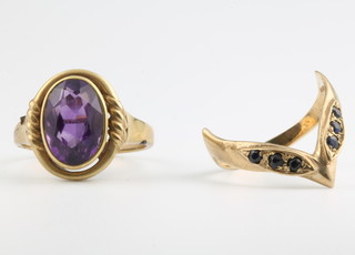 A 9ct yellow gold amethyst ring size S and a do. wishbone ring size M 