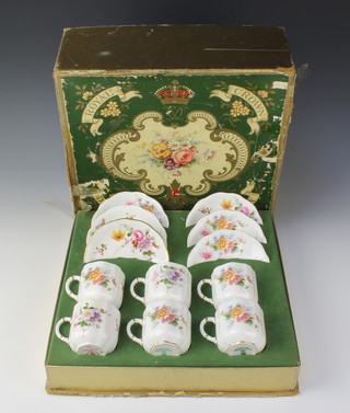 A matched set of 6 Royal Crown Derby floral pattern coffee cans and saucers (2 coffee cans and saucers of a later date) contained in a rectangular box 
