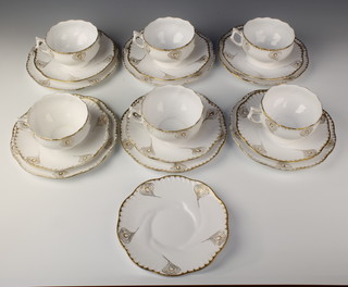 A 19 piece French Art Nouveau gilt patterned tea service comprising 6 tea plates 6"d, 6 large cups, 7 saucers