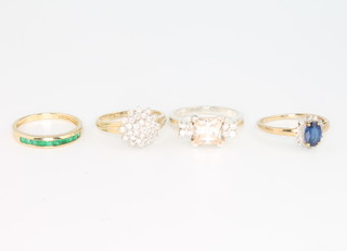 Three 9ct yellow gold gem set rings and a silver ditto, size Q