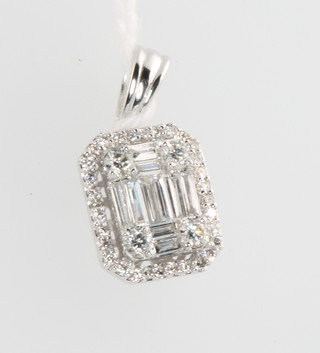 An 18ct white gold baguette and brilliant cut diamond pendant, approx 0.64ct, measures 10mm x 8mm