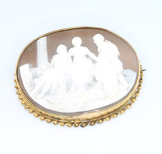 A Victorian oval cameo brooch with a group of classical figures amongst ruins 60mm x 50mm