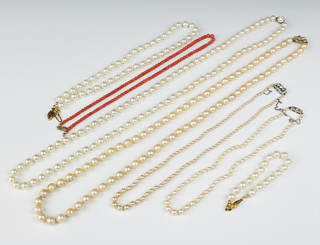 A coral bead necklace 15" and a quantity of imitation pearl necklaces