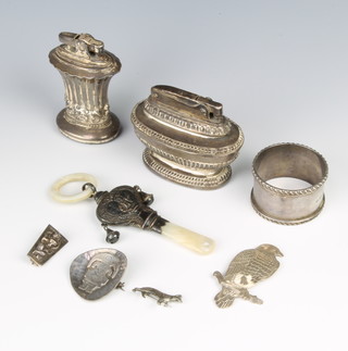 A repousse silver rattle and teether, Birmingham 1924, a napkin ring, minor jewellery and 2 cigarette lighters