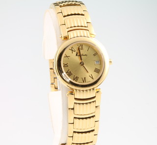 A lady's gilt cased Kutchinsky calendar wristwatch on a gilt bracelet, complete with box